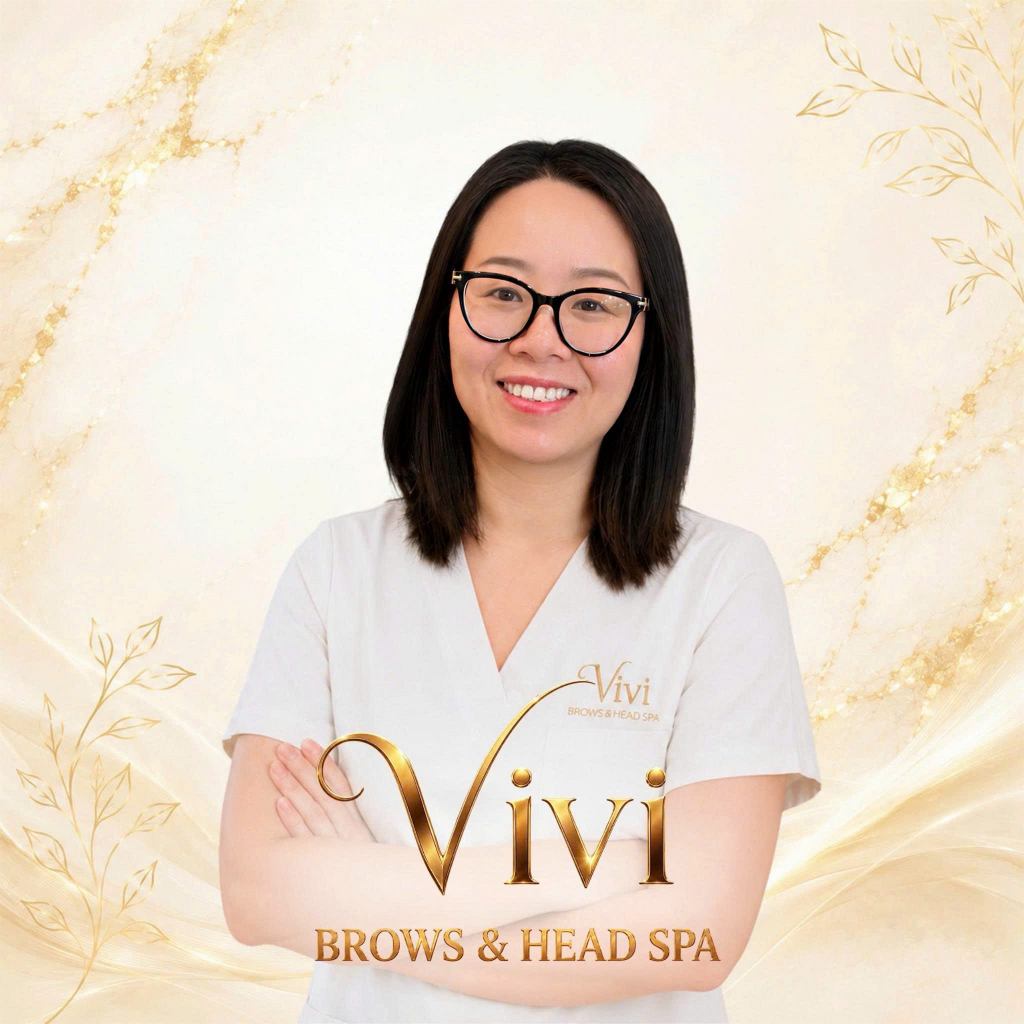 Vivi, the permanent makeup brow artist at Vivi Brows and Head Spa, smiling in her studio